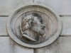 Medaglione in marmo sulla facciata di Palazzo San Crispino, risalente al 1841.